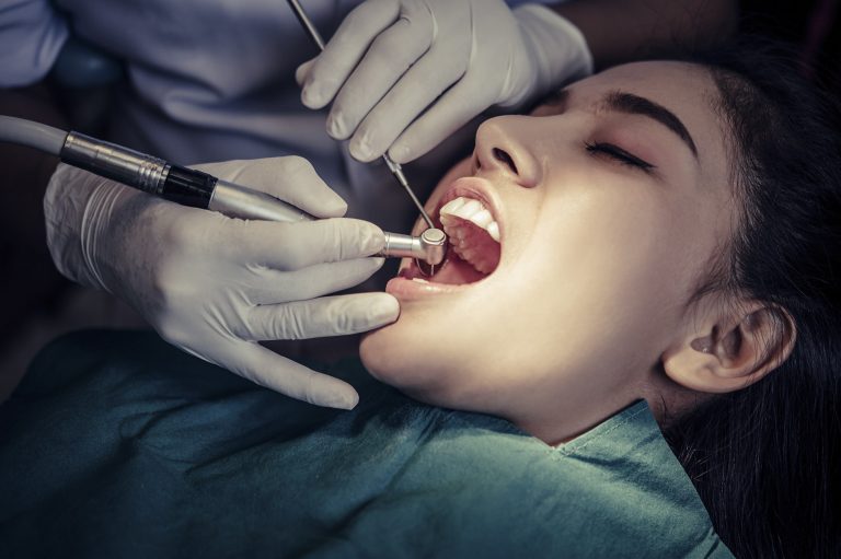 Dentist treating a patient's lost filling