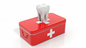 illustration of a tooth on top of a first aid kit